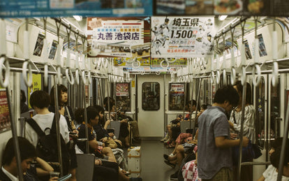 Commuters on a Japanese undergound train.