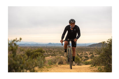 Yuri biking in the desert landscape