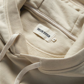 material shot of the label and drawstring on The Fillmore Hoodie in Natural