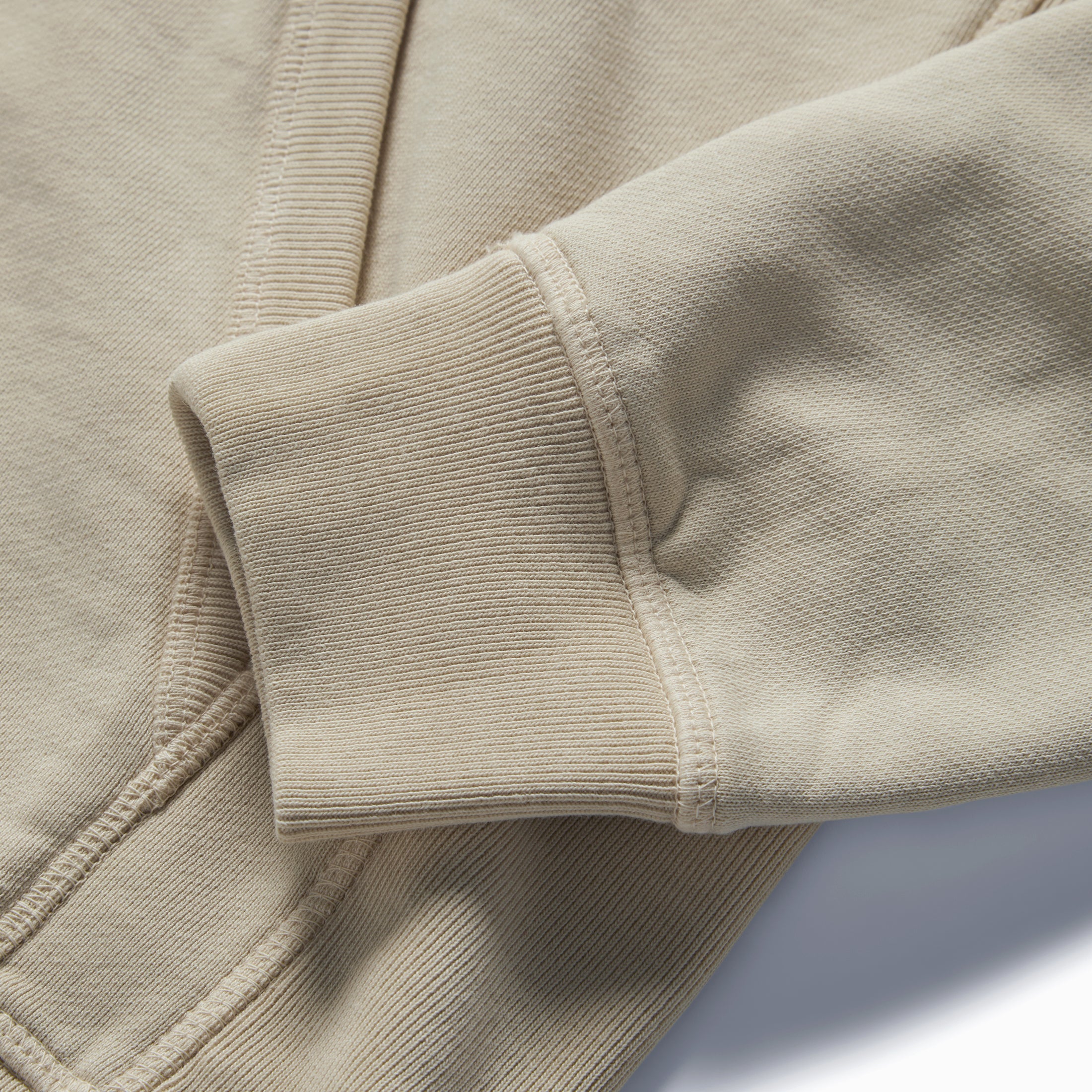 material shot of the ribbed cuff on The Fillmore Hoodie in Natural, Knits by Taylor Stitch