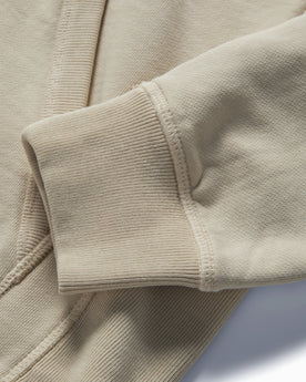 material shot of the ribbed cuff on The Fillmore Hoodie in Natural, Knits by Taylor Stitch