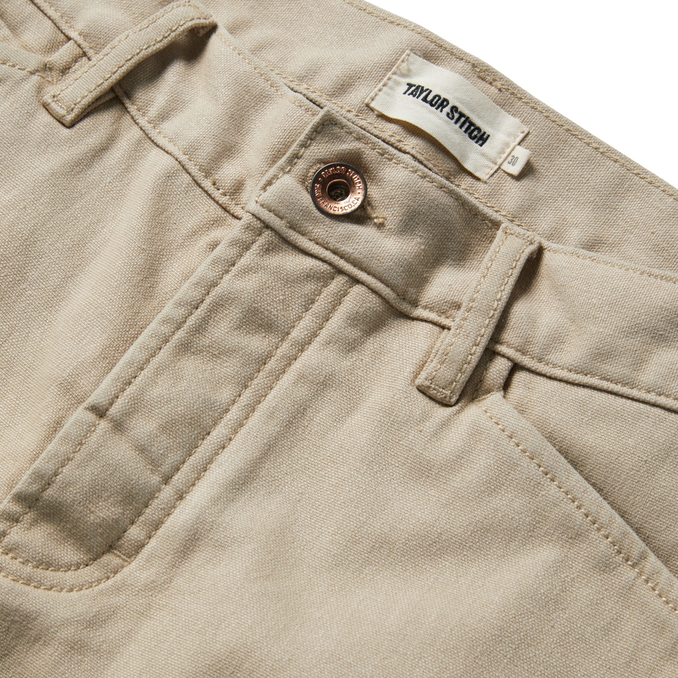 material shot of the button opening and fly of The Camp Pant in Sand Boss Duck, Bottoms by Taylor Stitch