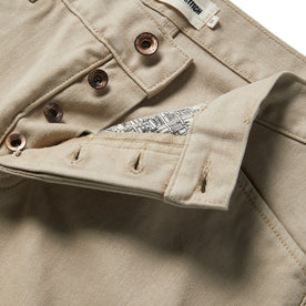 material shot of the buttons and map pocket printing on The Camp Pant in Sand Boss Duck