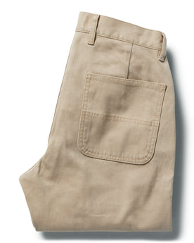 flatlay of The Chore Pant in Sand Boss Duck, shown folded from the back, Bottoms by Taylor Stitch