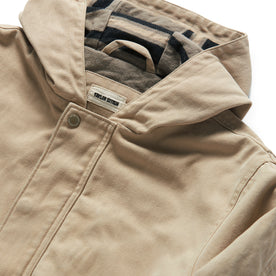 material shot of the hood and button closure of The Workhorse Hoodie in Sand Boss Duck
