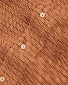 material shot of the buttons on The Short Sleeve Hawthorne in Rust Pickstitch Waffle, Wovens by Taylor Stitch