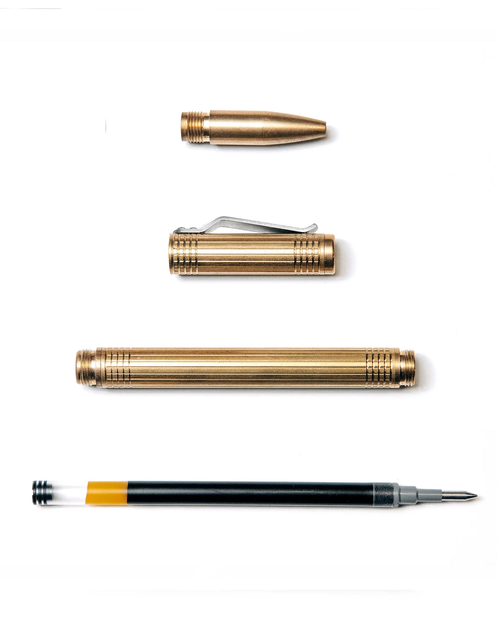 flatlay of The Pen in Brass shown open, Accessories by Taylor Stitch