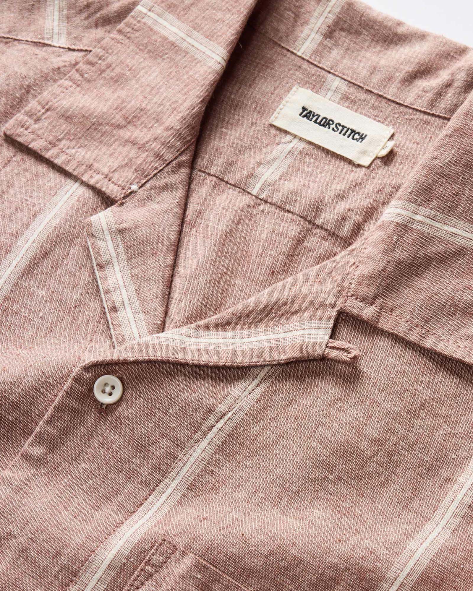 editorial image of The Short Sleeve Hawthorne in Dried Fig Stripe the beach, Wovens by Taylor Stitch