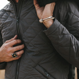 Close up shot of our fit model wearing the vertical jacket 