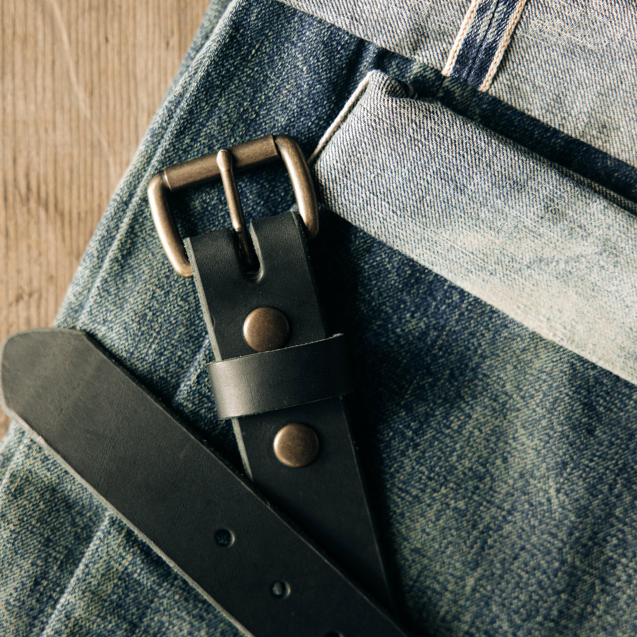 material shot of the rivets on The Standard Belt in Black, Accessories by Taylor Stitch