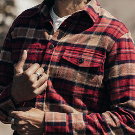 close up of fit model buttoning the cuffs on The Crater Shirt in Cardinal Check