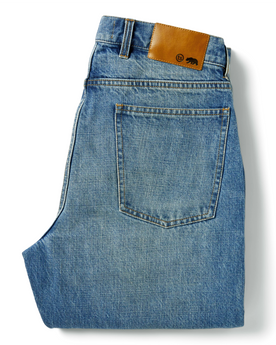 flatlay of The Democratic Jean in Patch Wash Selvage, shown folded from the back, Bottoms by Taylor Stitch