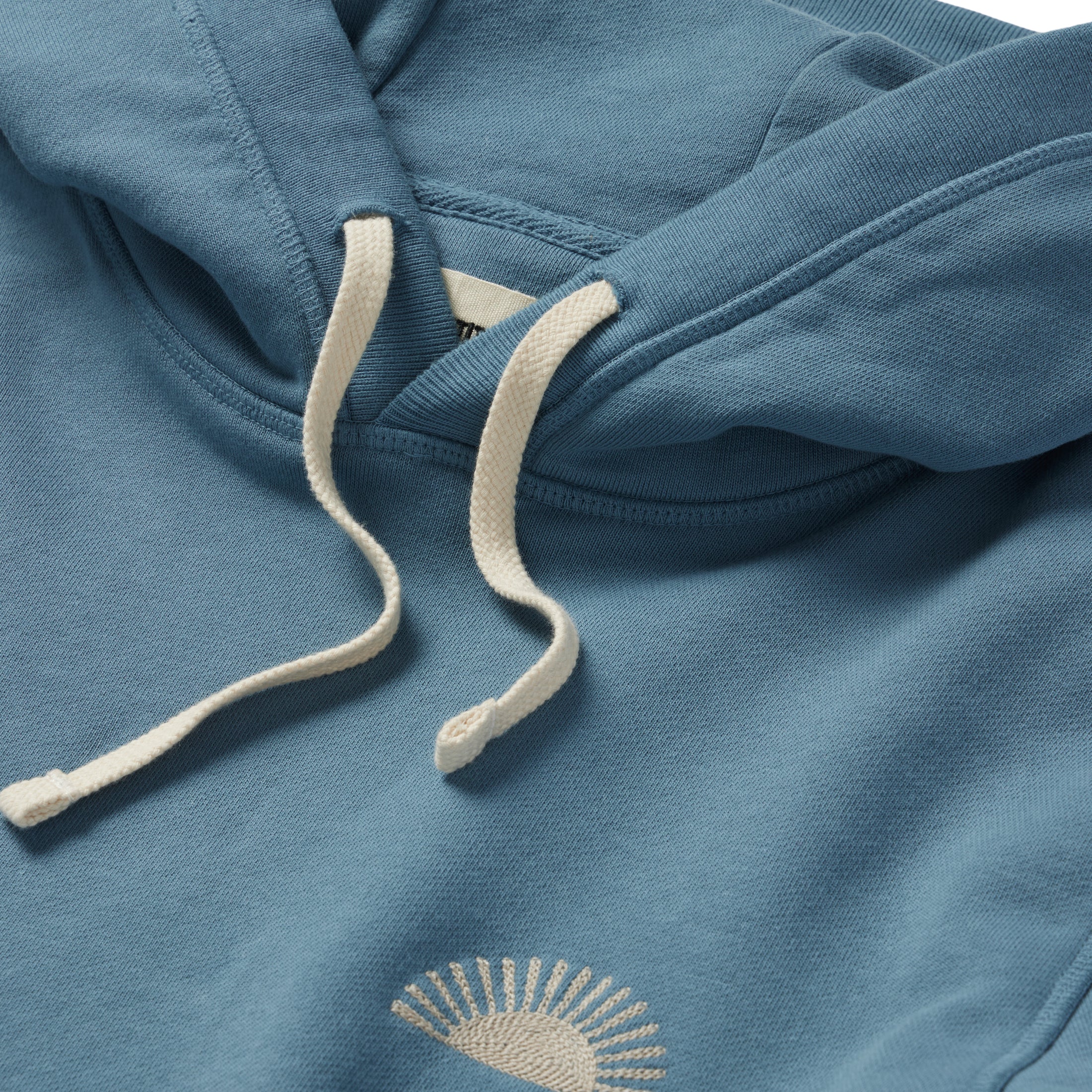 material shot of the drawcords and hood on The Fillmore Hoodie in Ocean and Natural , Knits by Taylor Stitch