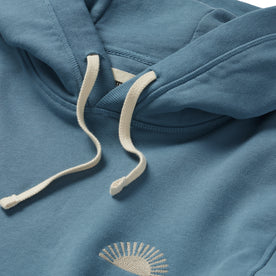 material shot of the drawcords and hood on The Fillmore Hoodie in Ocean and Natural 