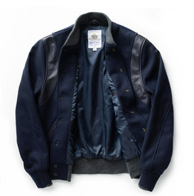 flatlay of The Golden Bear Snap Bomber in Midnight Wool, shown open