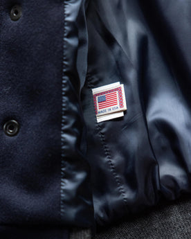 material shot of the made in USA label on The Golden Bear Snap Bomber in Midnight Wool, Outerwear by Taylor Stitch