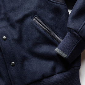 material shot of the pockets on The Golden Bear Snap Bomber in Midnight Wool