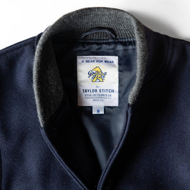 material shot of the Golden Bear label on The Golden Bear Snap Bomber in Midnight Wool