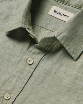 material shot of the collar and buttons on The Short Sleeve California in Army Hemp, Wovens by Taylor Stitch
