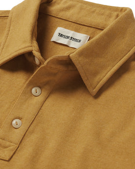material shot of the collar and buttons on The Heavy Bag Polo in Gold, Knits by Taylor Stitch