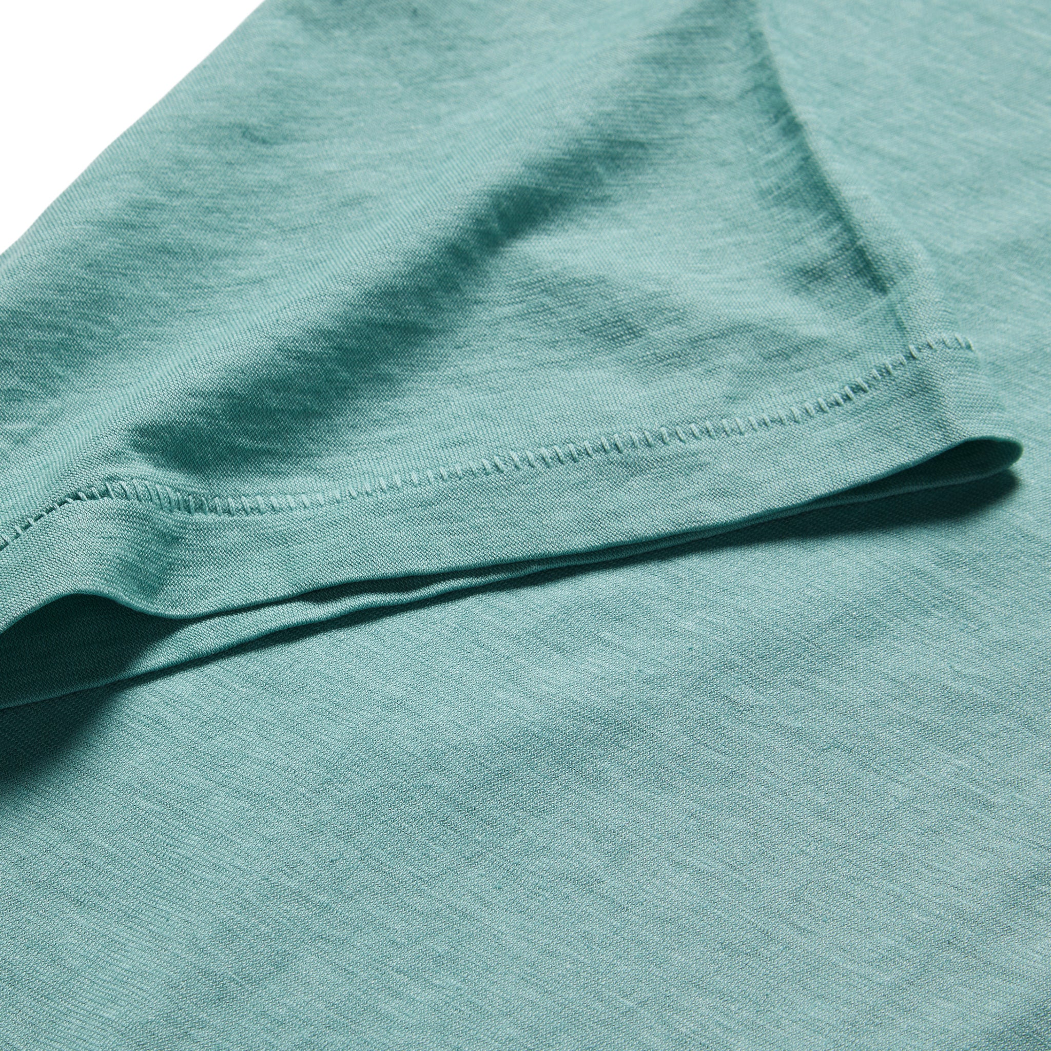 material shot of the sleeve on The Cotton Hemp Tee in Teal, Knits by Taylor Stitch