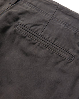 material shot of the rear pocket on The Morse Short in Dark Charcoal Linen, Shorts by Taylor Stitch