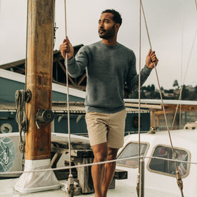 fit model posing on a sailboat in The Morse Short in Sand Linen