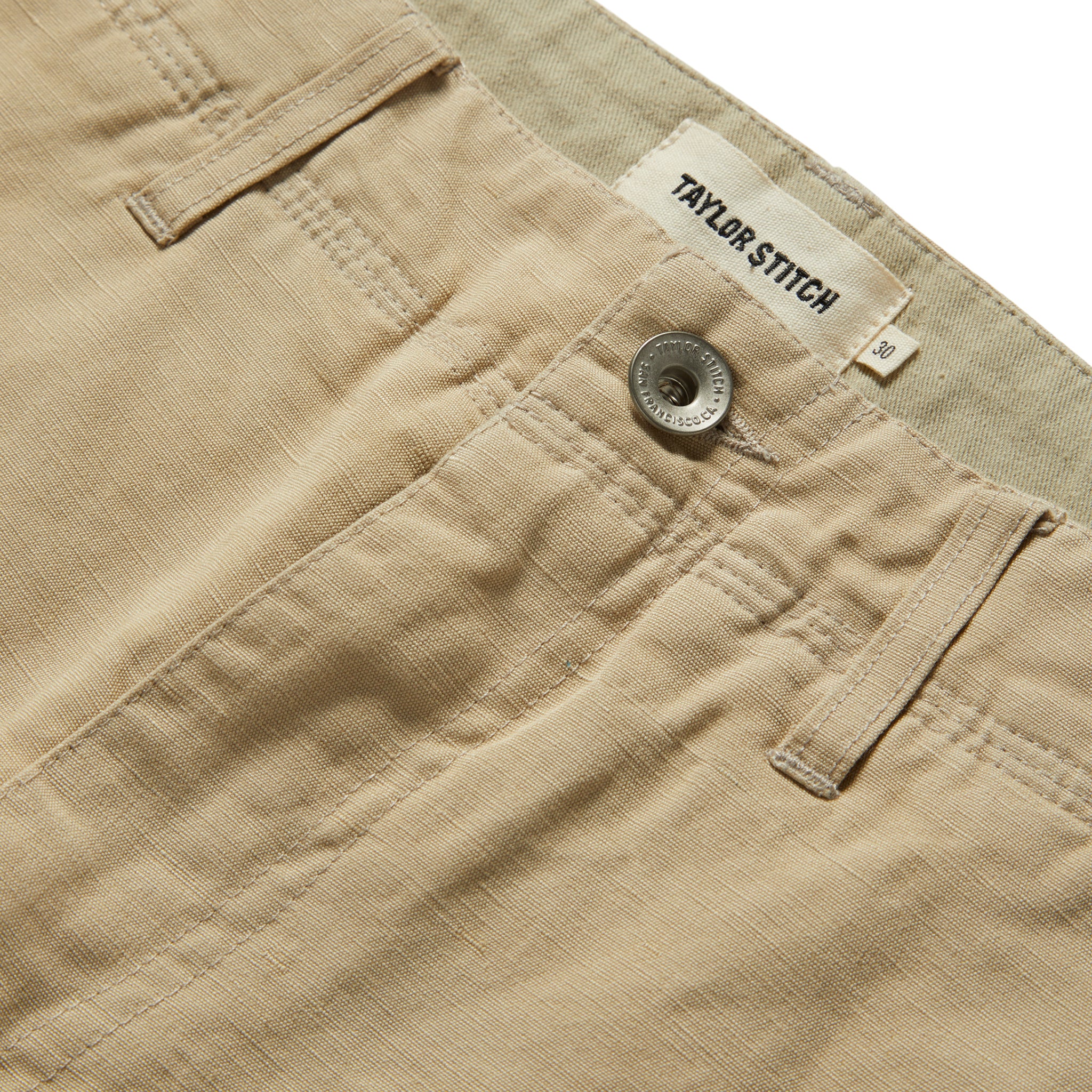 material shot of the button on The Morse Short in Sand Linen, Bottoms by Taylor Stitch