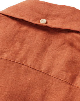 material shot of the rear collar button on The Jack in Apricot Linen, Wovens by Taylor Stitch