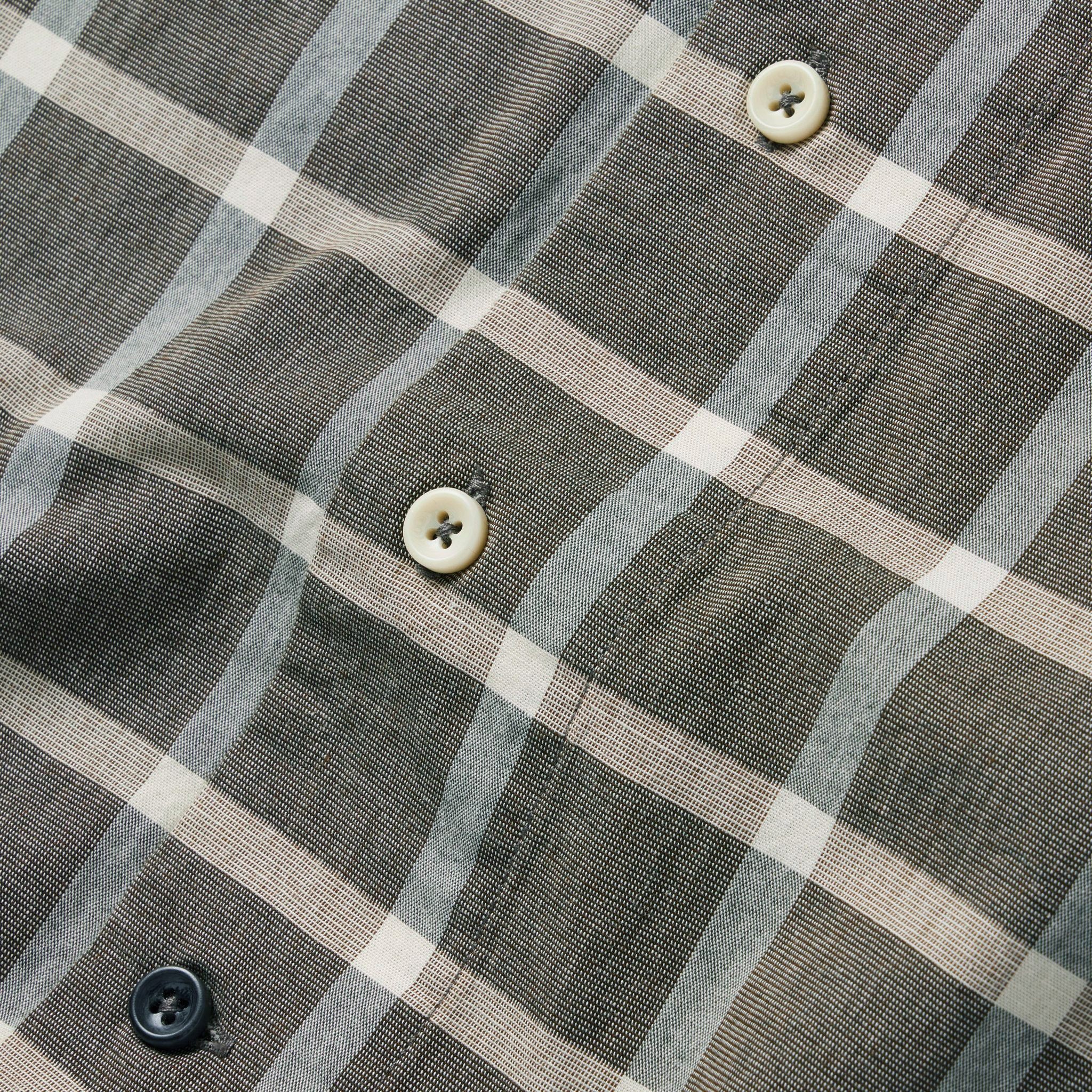 material shot of the buttons on The Short Sleeve Hawthorne in Espresso Plaid, Wovens by Taylor Stitch