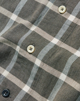 material shot of the buttons on The Short Sleeve Hawthorne in Espresso Plaid, Wovens by Taylor Stitch