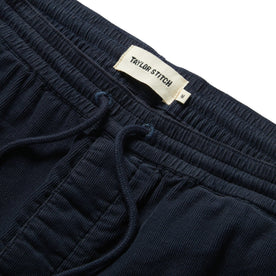 material shot of the waistband on The Après Short in Dark Navy Pinwale
