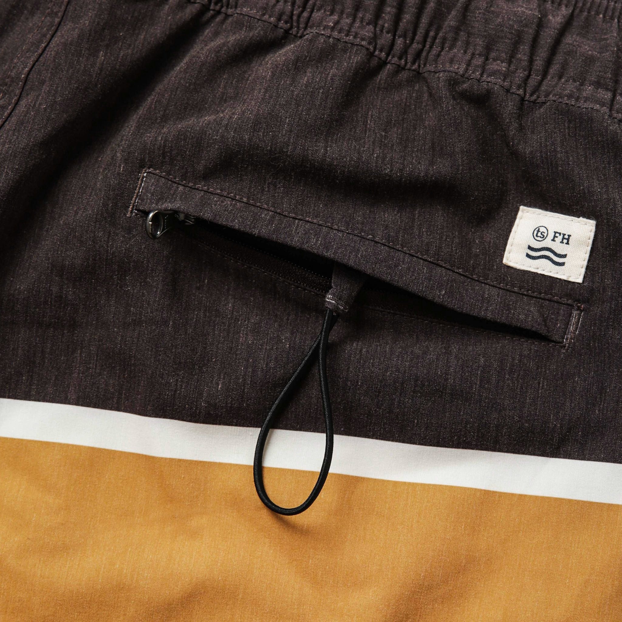 material shot of the rear pocket on The Bayberry Trunk in Sandbar, Bottoms by Taylor Stitch