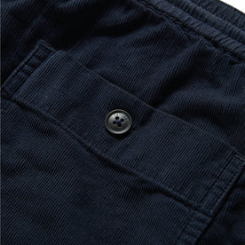 material shot of the back pocket on The Après Short in Dark Navy Pinwale