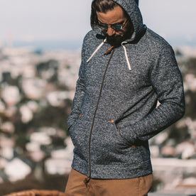 The fit model showing the Apres hoodie zipped up