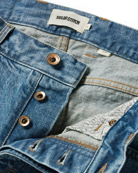 material shot of the button closures on The Slim Jean in Patch Wash Selvage, Bottoms by Taylor Stitch