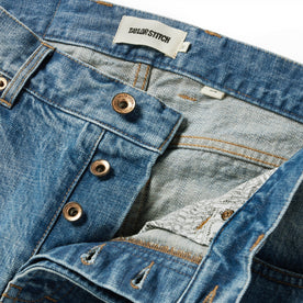 material shot of the button closures on The Slim Jean in Patch Wash Selvage