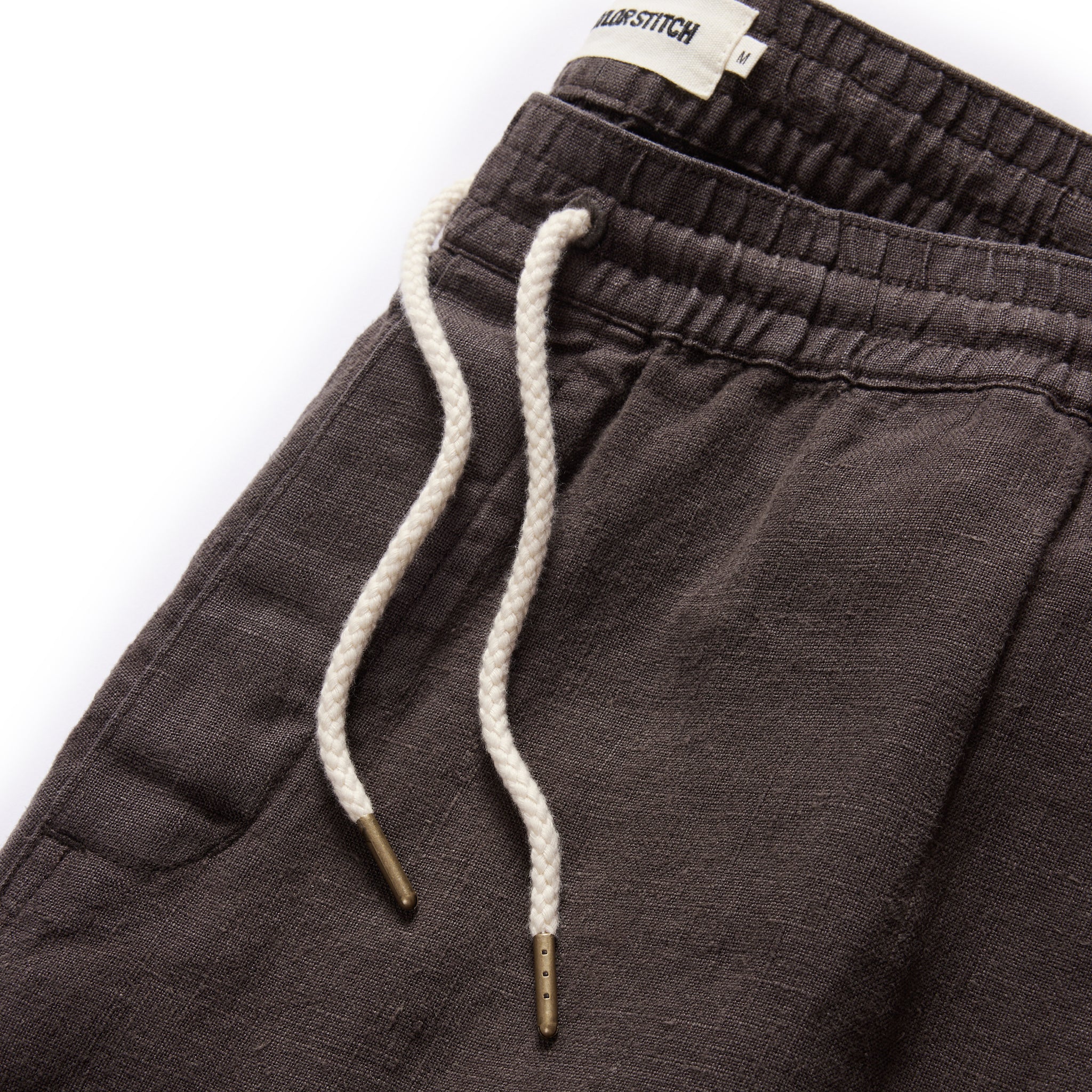 material shot of the drawcords on The Apres Pant in Shadow Hemp, Bottoms by Taylor Stitch