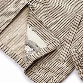 material shot of the two way zipper and SF map print pocketing on The Clark Jacket in Morita Stripe