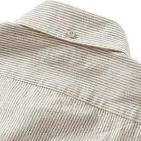 material shot of the button on the back collar of The Jack in Coal Jaspe University Stripe Oxford