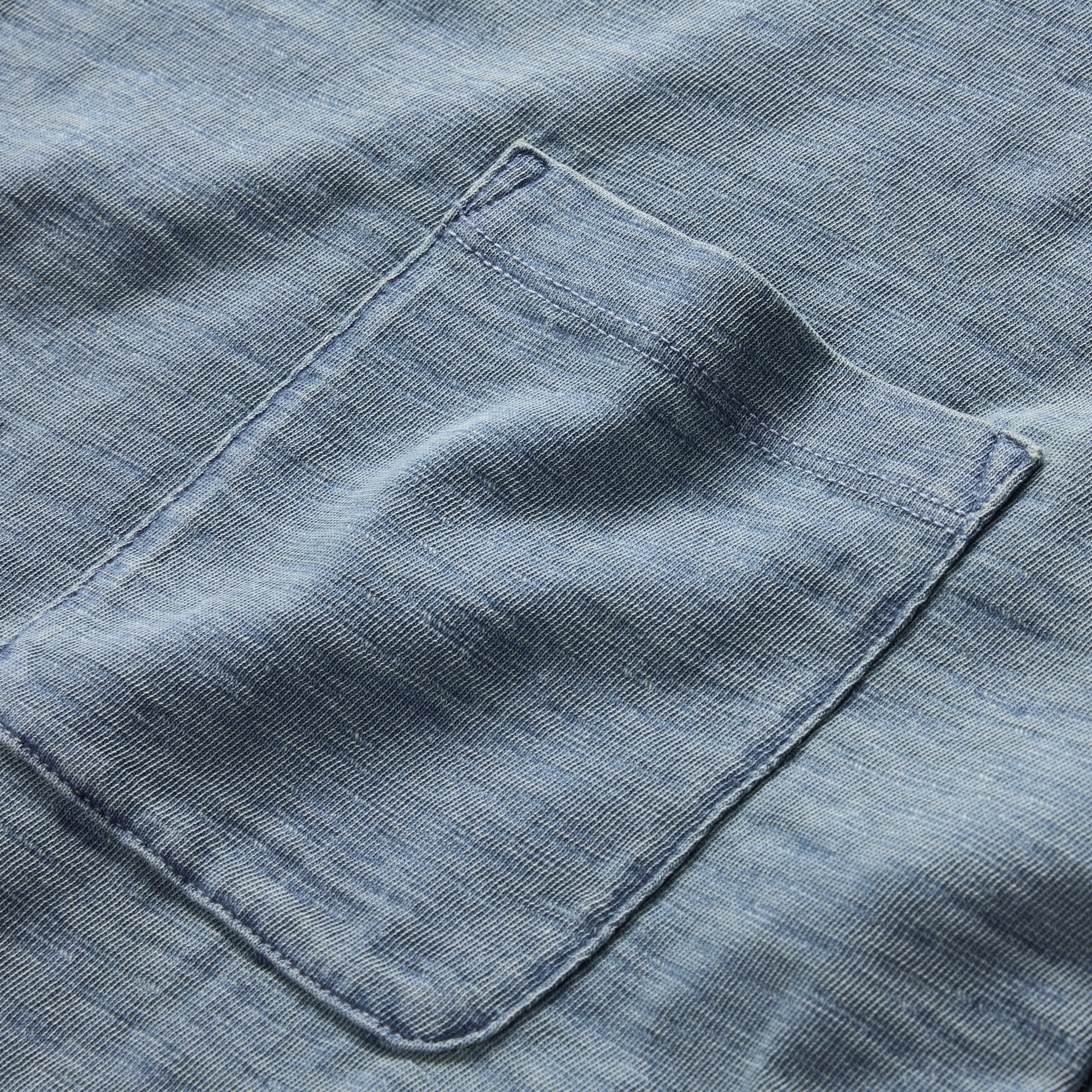 material shot of the front chest pocket on The Organic Cotton Tee in Dyed Indigo, Knits by Taylor Stitch
