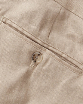 material shot of the back welted pocket on The Sheffield Trouser in Natural Linen, Bottoms by Taylor Stitch