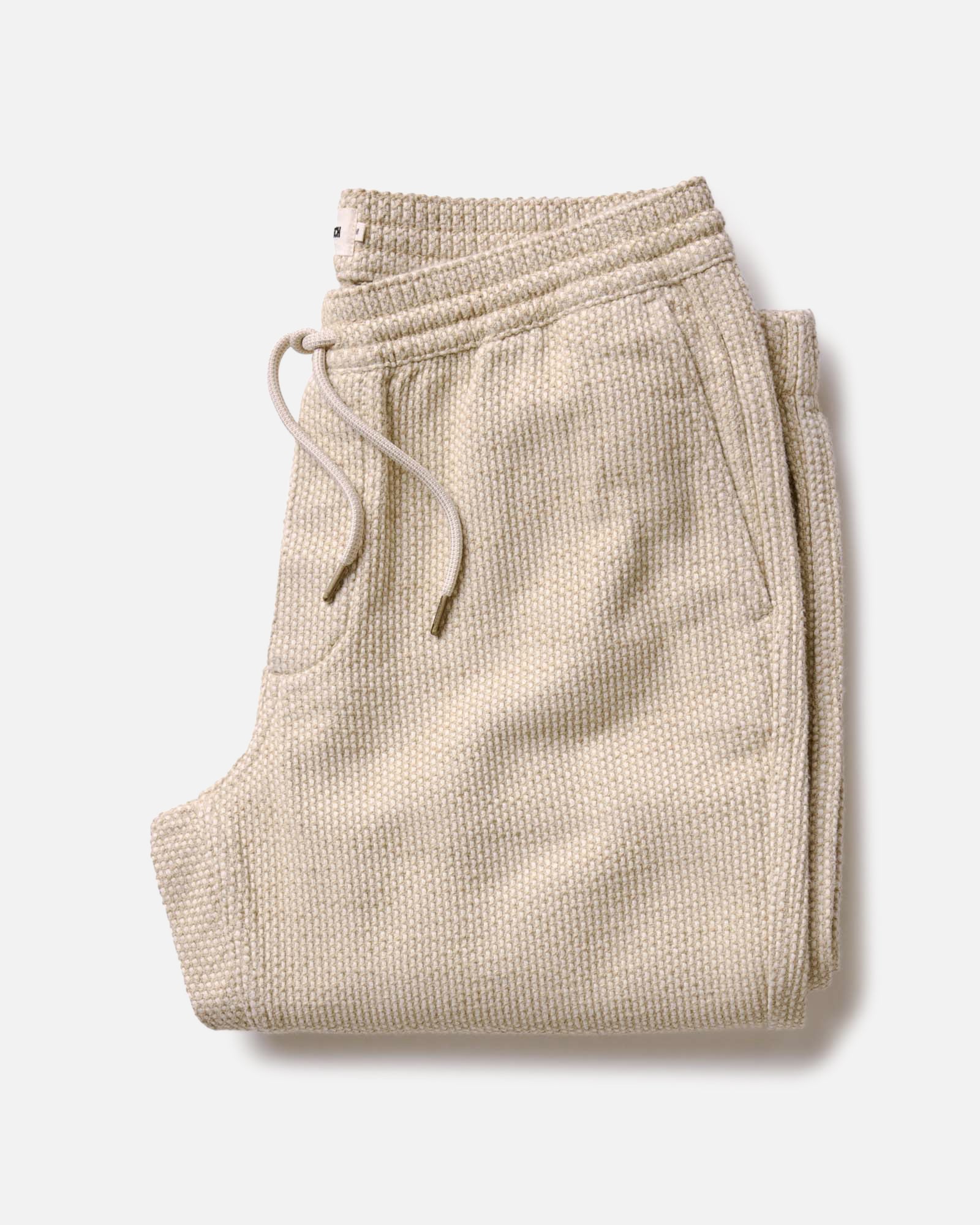 flatlay of The Apres Pant in Natural Sashiko folded, Bottoms by Taylor Stitch