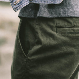 Our fit model wearing The Slim Chino in Organic Olive.