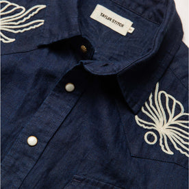 material shot of the collar and buttons on The Embroidered Short Sleeve Western in Indigo Linen