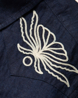 material shot of the embroidered yokes on The Embroidered Short Sleeve Western in Indigo Linen, Wovens by Taylor Stitch