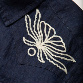 material shot of the embroidered yokes on The Embroidered Short Sleeve Western in Indigo Linen