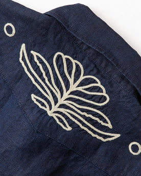 material shot of the back embroidered yoke on The Embroidered Short Sleeve Western in Indigo Linen, Wovens by Taylor Stitch