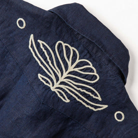 material shot of the back embroidered yoke on The Embroidered Short Sleeve Western in Indigo Linen