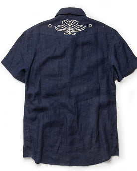flatlay of The Embroidered Short Sleeve Western in Indigo Linen, from the back, Wovens by Taylor Stitch